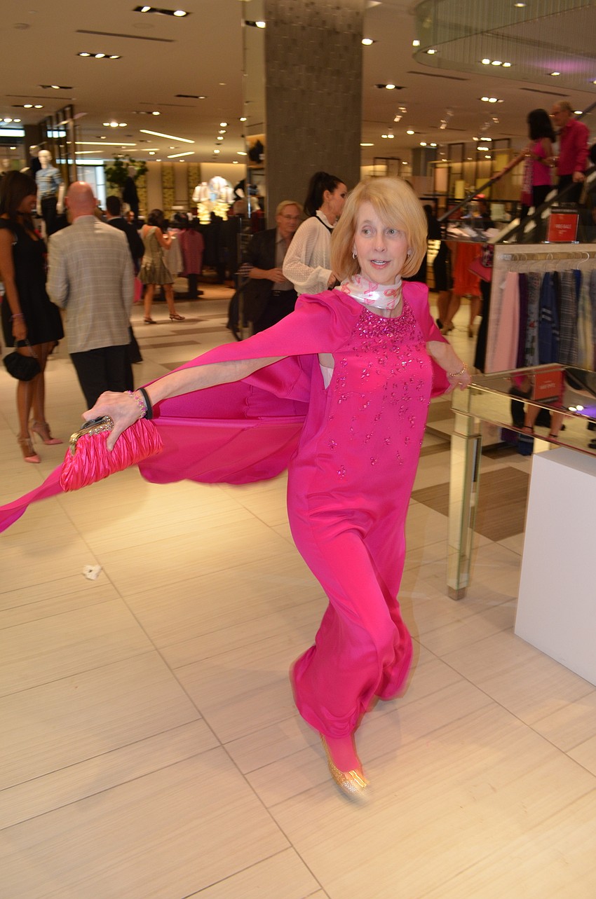 Katherine Keeley models her pink-caped gown.