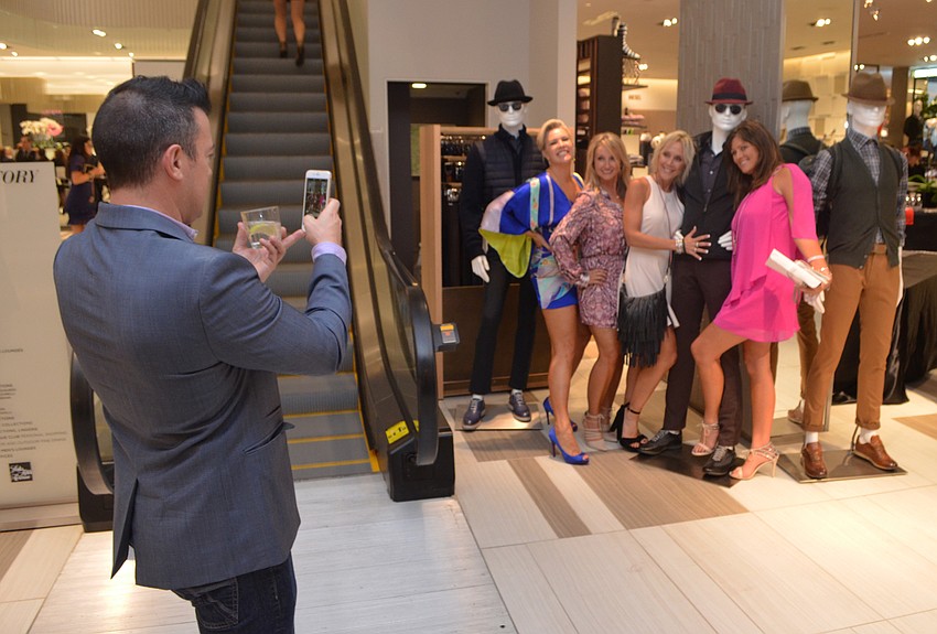 Teresa Lee-Kay, Angela Radigan, Renee Preininger and Katie Emmons get their picture taken in front of their favorite male mannequin.