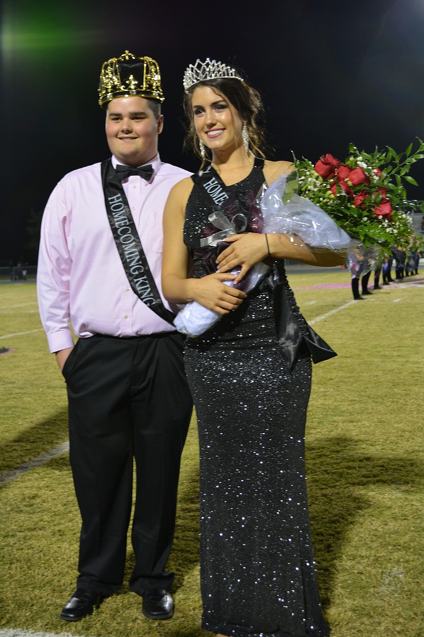 Seniors Connor Nugent and Sarah Crawford stand before their peers after being named Homecoming King and Queen.