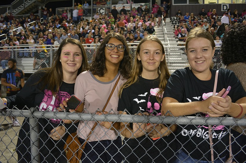 Olivia Mileski, Alessandra Nakhla, Alyssa Melita and Peyton McDaniel watch most of the homecoming game as close to the field as they can get.