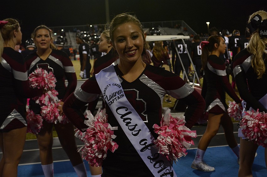 Cheerleading captain Lauren Kvederis cheered her final homecoming game.