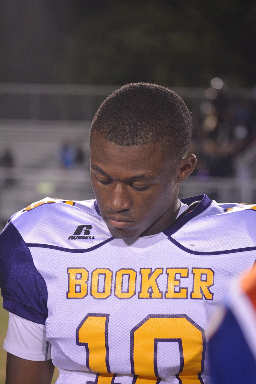 Booker junior WR/DB Jahvaron Burks listens to the referees during the captains' meeting before the Tornadoes' game against Southeast on Oct. 28. Booker lost 28-21.