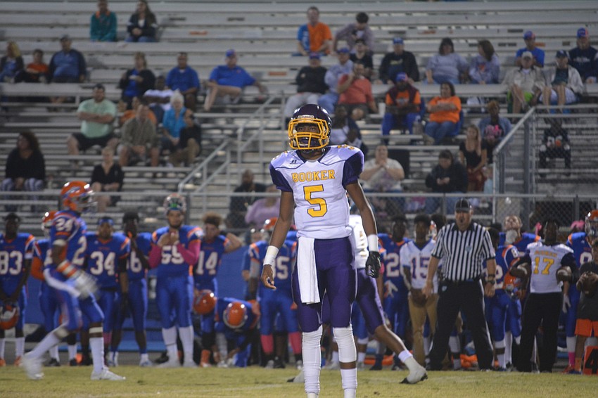 Booker junior quarterback Arthur Brantley IV looks to the sideline for the Tornadoes' next play during the team's game against Southeast on Oct. 28.