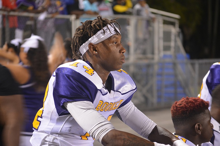 Booker senior safety Eunique Arnold sits on the bench following a Southeast touchdown on Oct. 28. The Tornadoes lost 28-21.