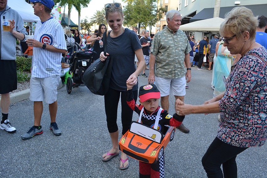Three-year-old Parker Royalty, of River Club, dances with his mother, Jaclyn Royalty, left, and grandmother, Karen Hoffman, right.