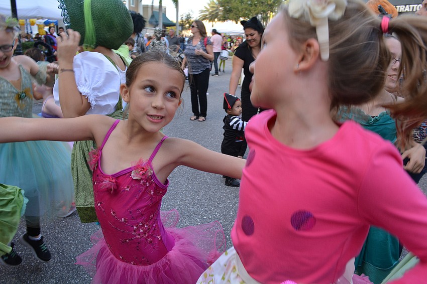 Sarasota's Kaedynce Morris and Bradenton's Julie Harris dance for fun before they perform with Reflex Dance Arts.