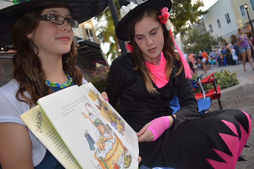 Haley Dragon and Libbyann Ling, students at Braden River Middle School, read 