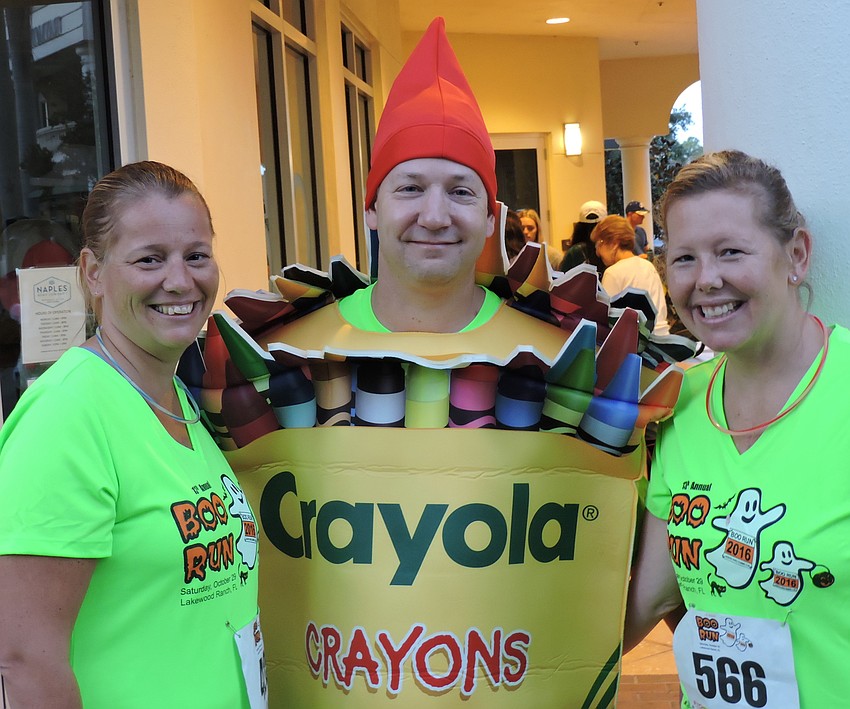 Sherrie Hanrahan and Tara Wood of Riverview allow Lakewood Ranch's Nick Tullio, center, to color their world.