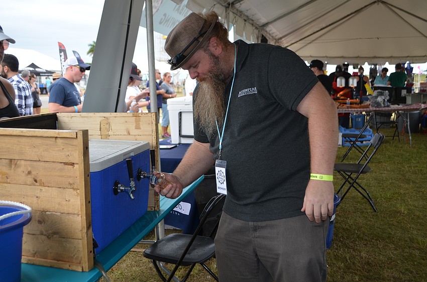 Matt Stetson of Accomplice Brewery and Ciderworks pours samples during Sip the Sunshine.