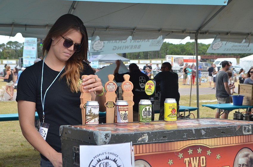 Lacey Blackman of Two Henry’s Brewing pours samples during Sip the Sunshine.