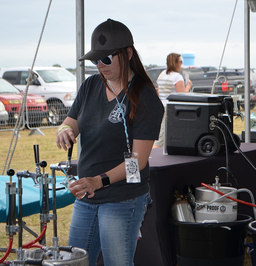 Jessica Holder of Rapp Brewing Company pours samples during Sip the Sunshine.