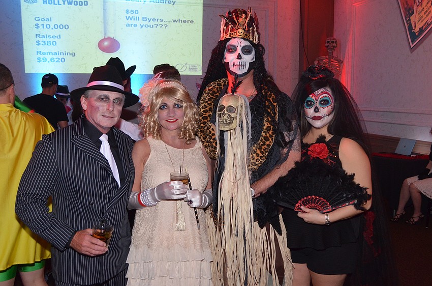 Greg Grodoski as a “gangster zombie,” Angela Grodoski as a “flapper girl,” Ryan Fletcher as a “witch doctor” and Anna Fletcher as “Day of the Dead”