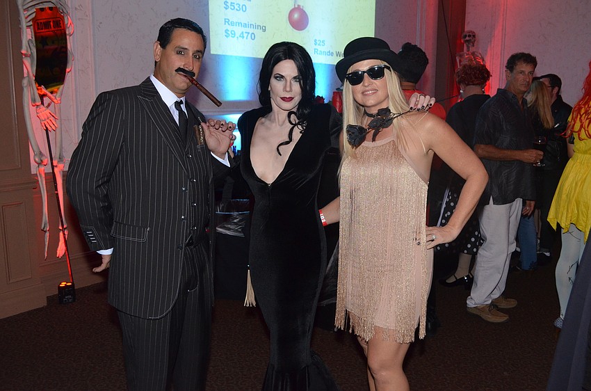 Matt Campayno and Renee Phinney as “Gomez and Morticia Addams” with Jenn Stutler