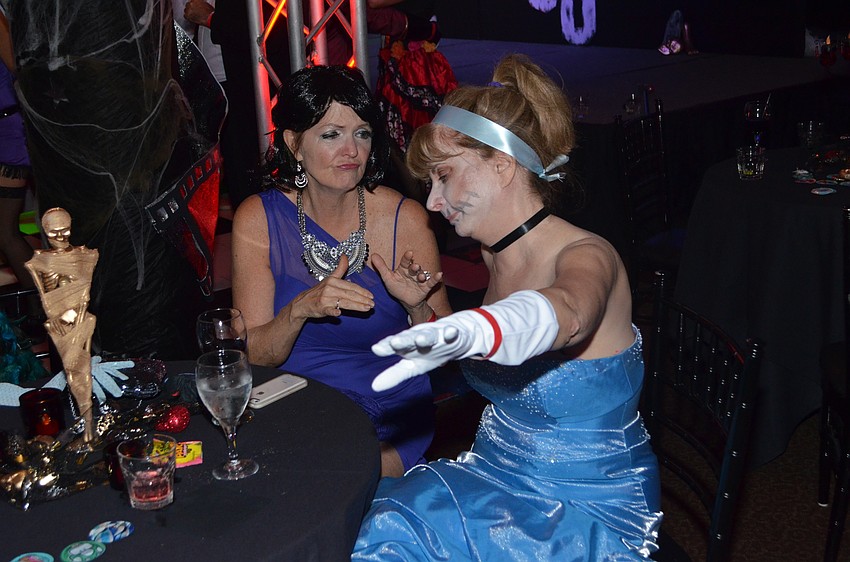 Myra McPheison, “May East,” dances with Pat Gardner, “Zombie Cinderella.”