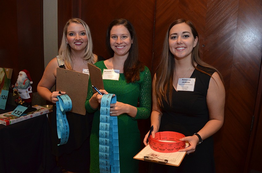Shelby Swartzentruber, Michelle Nerney and Rebecca Jenkins, Student Scholarship Ambassadors, sell tickets for the raffle.