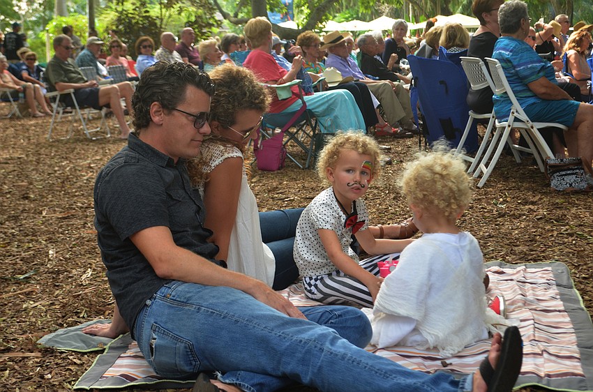 Jenny and John Parish sit with their children Tom Parish, 2, and Judy Parish, 4.