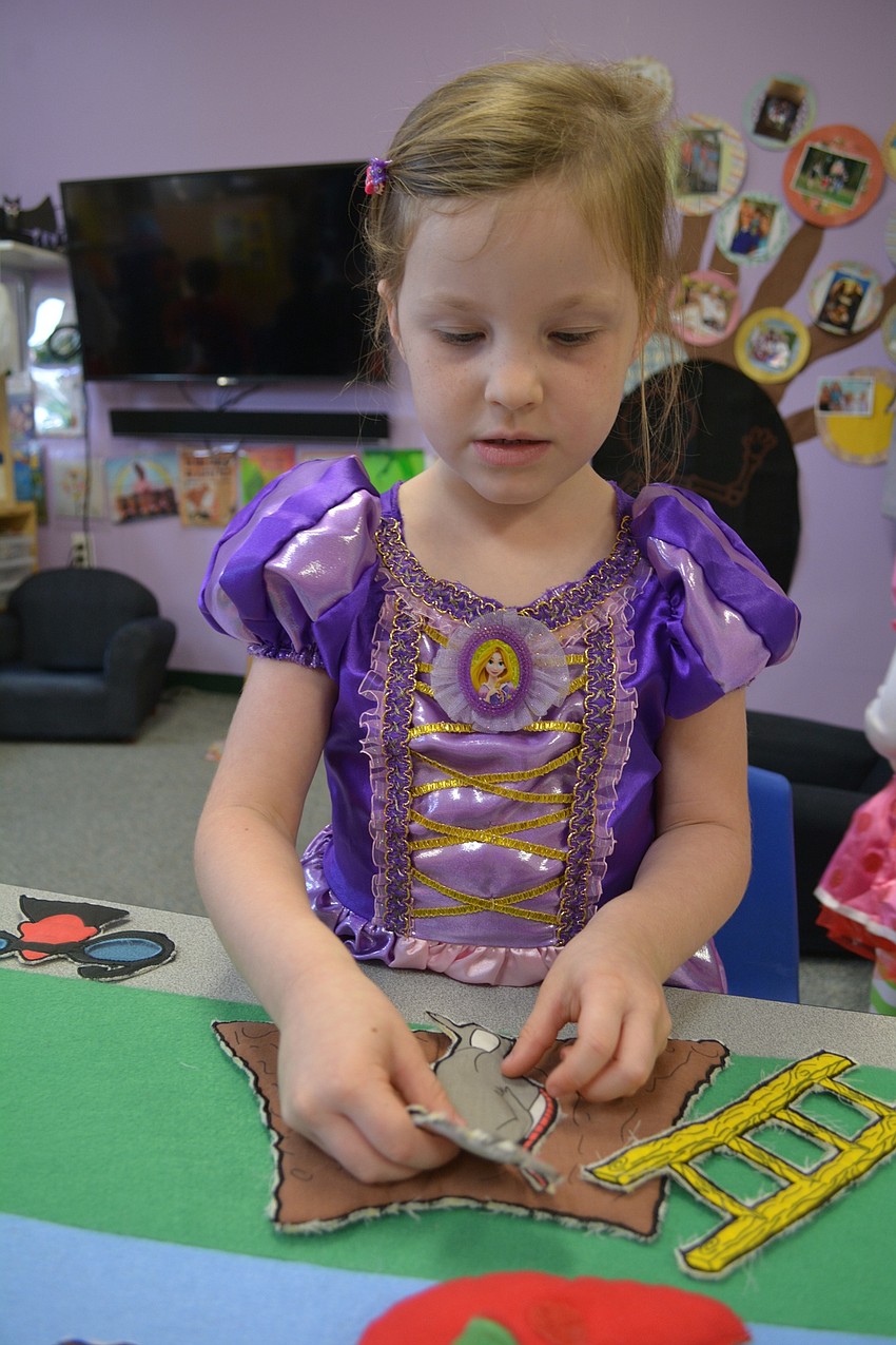 Four-year-old Laney Patterson picks her favorite princess, Rapunzel.