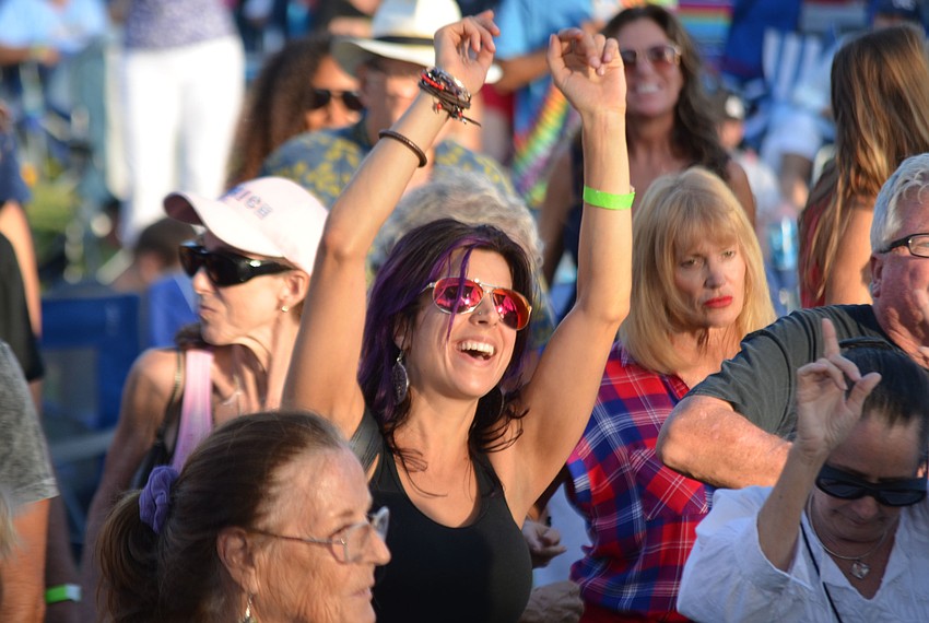 Crystal Kubis dances to reggae band Jah Movement at Giving Hunger the Blues on Sunday at Van Wezel Performing Arts Hall.