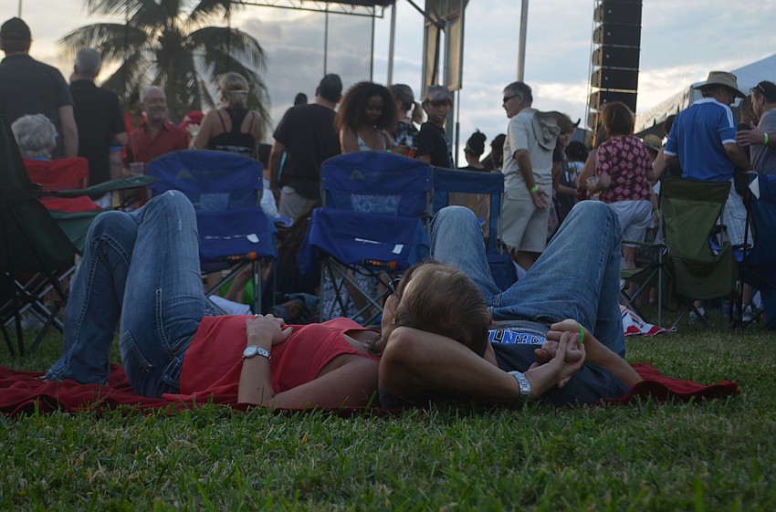 Carly Shaefer and Jonathan Young relaxed on the lawn during the Jah Movement concert.