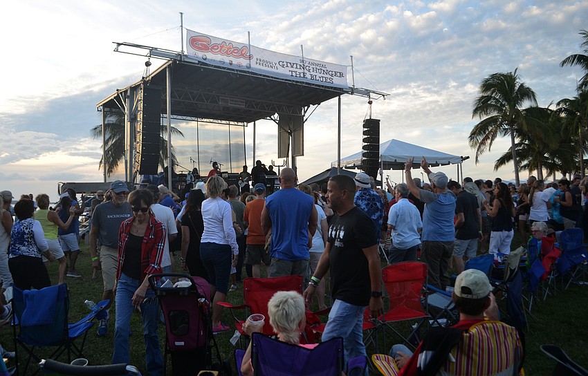 Many attendees gathered on the lawn to dance and listen to Jah Movement during Giving Hunger the Blues on Sunday at Van Wezel Performing Arts Hall.