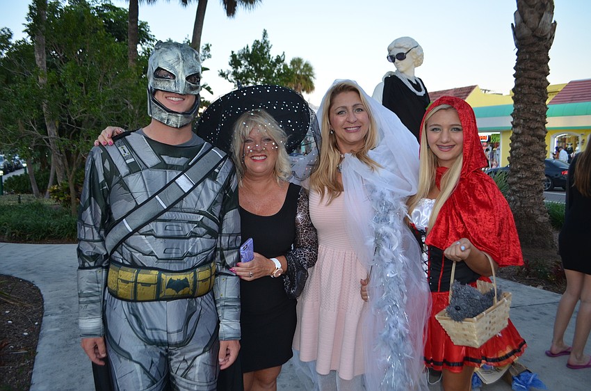 Sam Kluger, as Batman, Lee Ann Kluger as a witch, Alyssa Walters as a snow princess and Ginger Walters as Little Red Riding Hood.