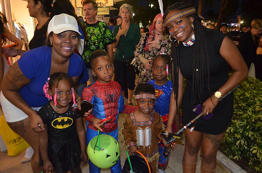 Roshanda Spencer, Tasiah,5, as Bat Girl, Markell, 7, as Spiderman, Alijah, 3, as an American Indian, Taleah Humphrey, 6, as Supergirl, and Jerronica Spencer.