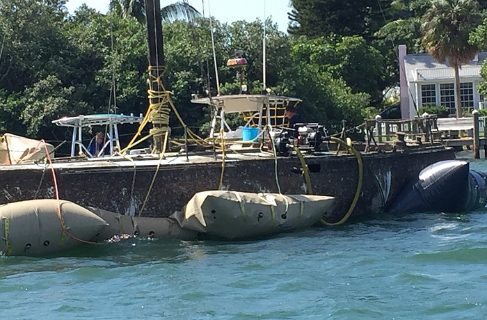 Blenker Boatworks and Marina of Bradenton worked  two days to raise the sunken sailboat. Note the inflated baldders that float the wreck. Courtesy photo
