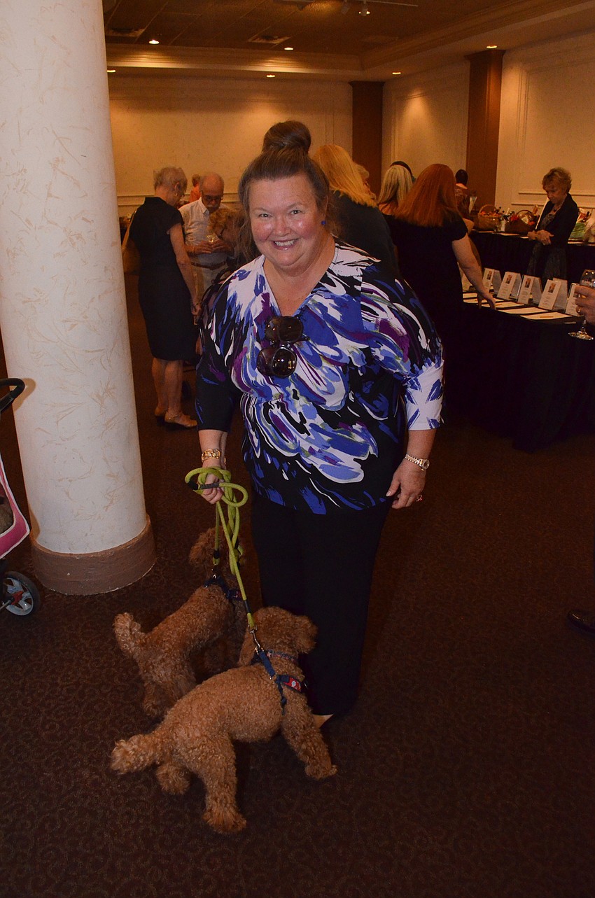 Freida Joyner with the dogs she’s fostering while they wait for someone to adopt them, Jimbo and Jackie