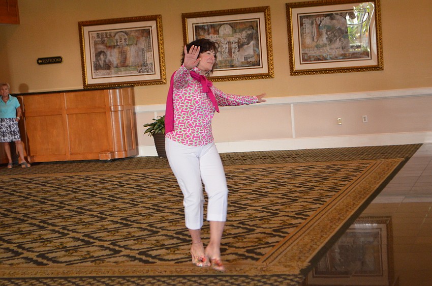 Andi Munzer modeled clothes from the Longboat Key Club’s pro shops at the Key Niner’s Women Golf Association opening luncheon.