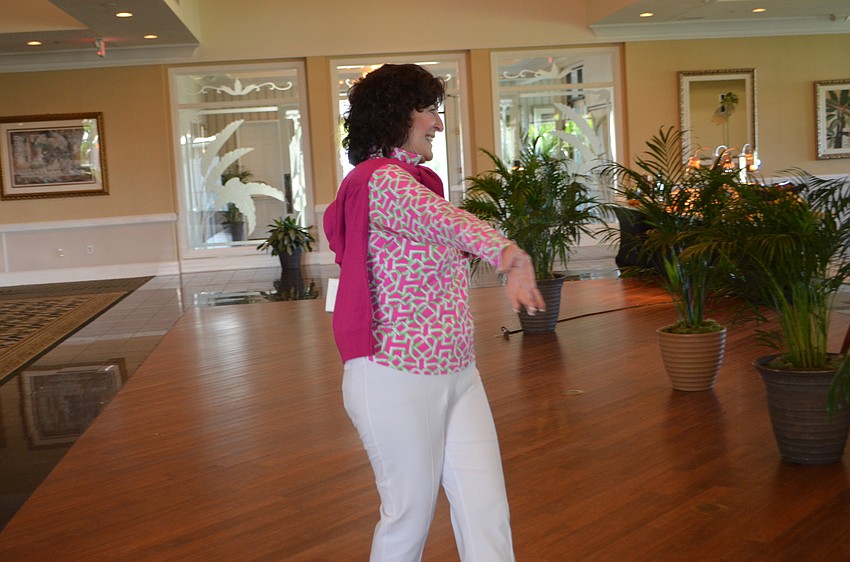 Andi Munzer modeled clothes from the Longboat Key Club’s pro shops at the Key Niner’s Women Golf Association opening luncheon.