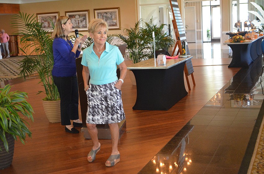 Bunny Skirboll modeled clothes from the Longboat Key Club’s pro shops at the Key Niner’s Women Golf Association opening luncheon.