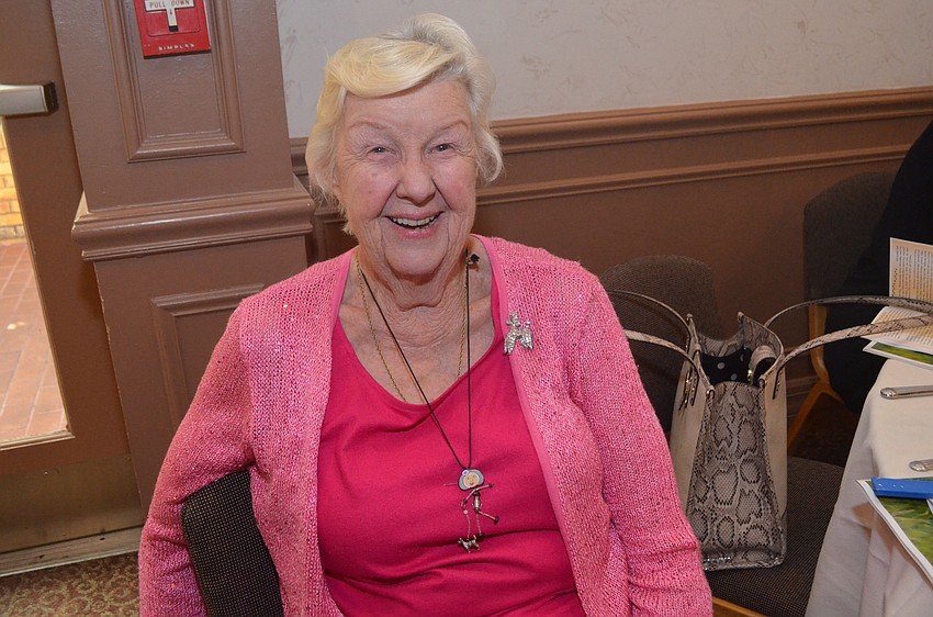 Mary Muller models her poodle and poodle-walker necklace, which she got from the Art Institute of Chicago, along with her sparkly poodle-shaped brooch.