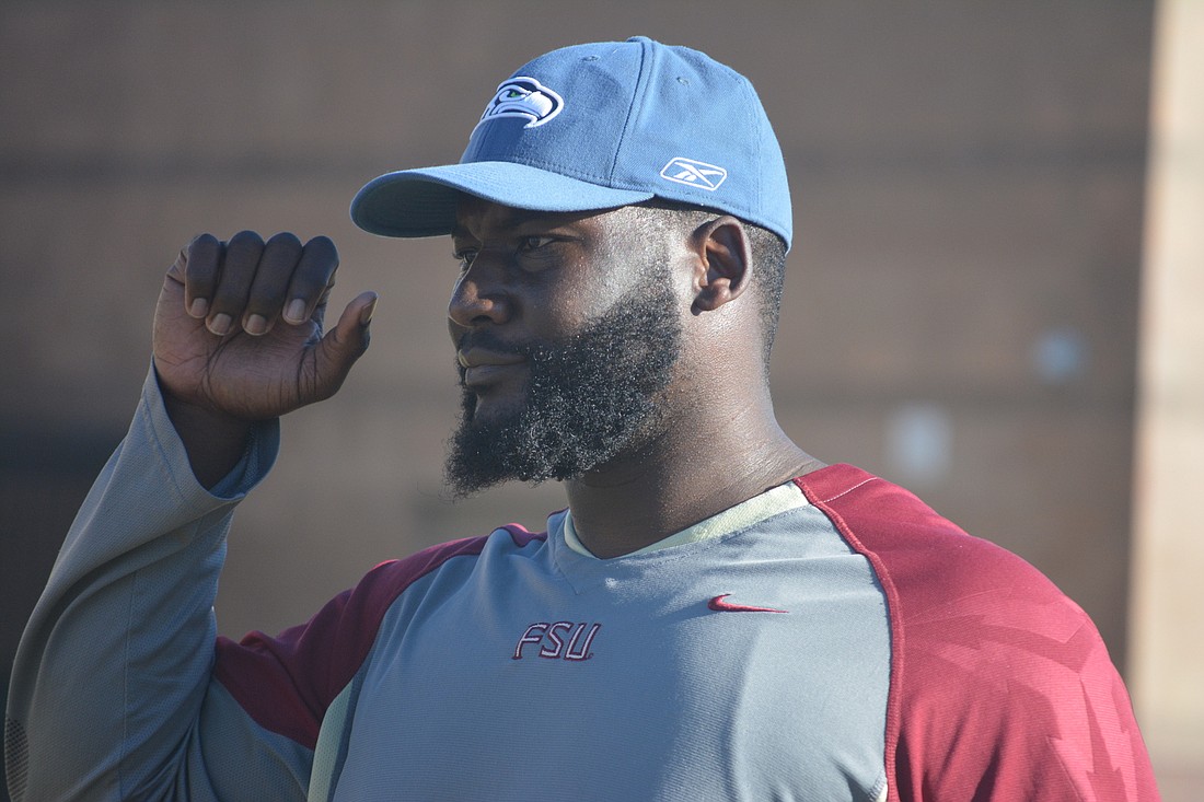 Booker interim coach Dumaka Atkins graduated from the school in 2004 and went to play football at Florida State.
