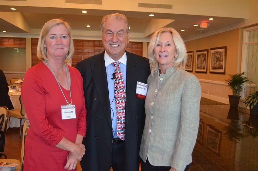 Linda Lutz, club President Joe McElmeel and Renee Balogh