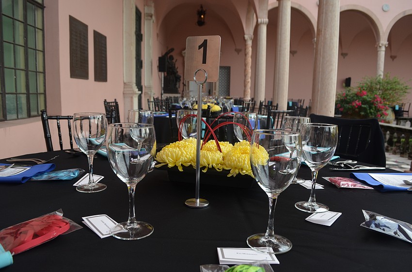 Table settings await guests on the loggia in the courtyard of the Ringling.