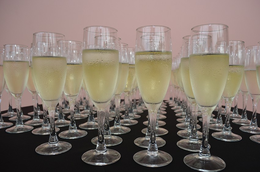 Champagne glasses await guests on the loggia in the courtyard of the Ringling.