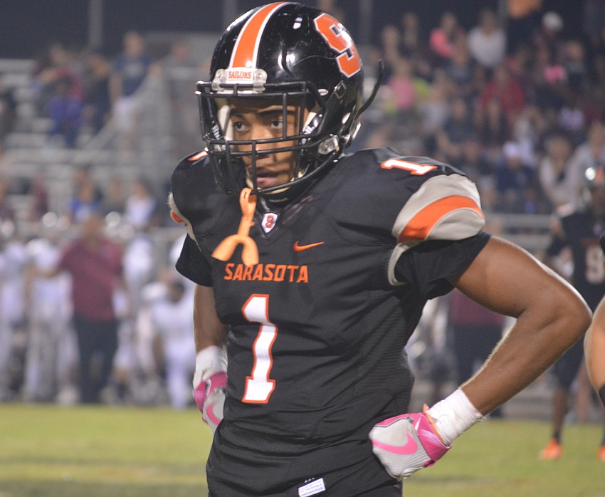 Sarasota senior wide receiver Dyshone Hayes look to his coaches for instruction late in his team's game against Riverview on Nov. 4. Sarasota lost 42-24.