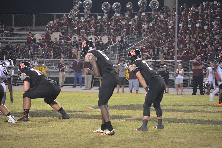 Sarasota senior wideout Xakari Hawkins takes a shotgun snap next to senior running back Davis Gurr against Riverview on Nov. 4. The Sailors lost 42-24.
