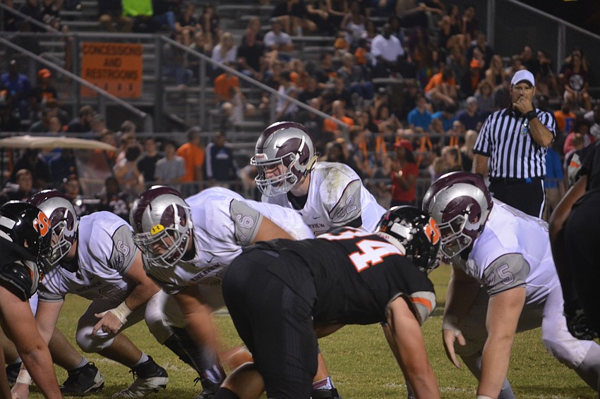 Riverview quarterback Mike Welcer prepares to take the snap from center against Sarasota on Nov. 4. Welcer  rushed for 109 yards on 11 carries.