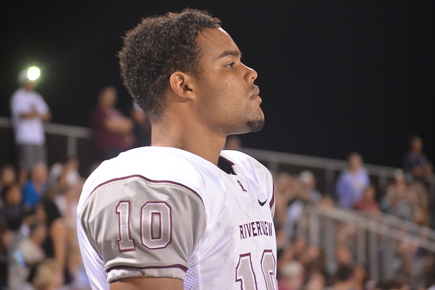 Riverview junior safety Cleve Grantley stands on the team bench and watches his offense during the Rams' game against Sarasota on Nov. 4.