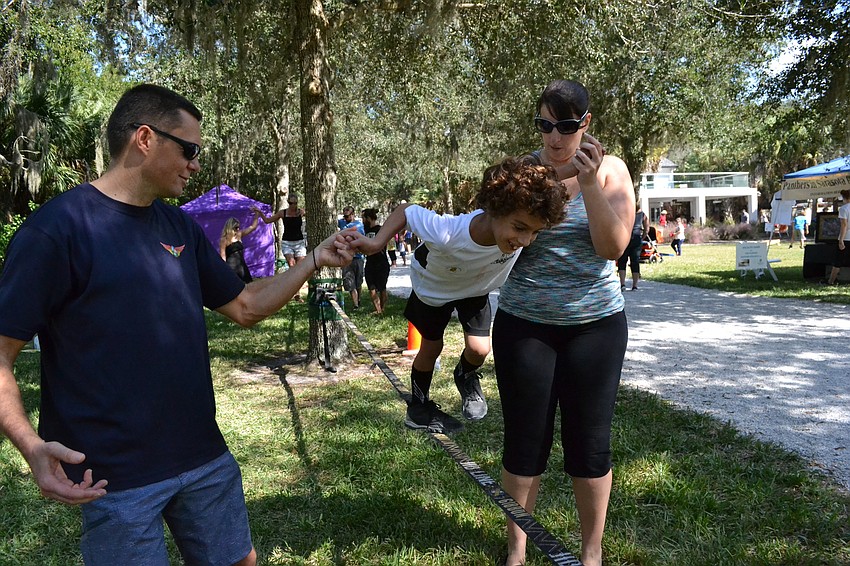 Milam Cantero tests his balance on a slack rope.
