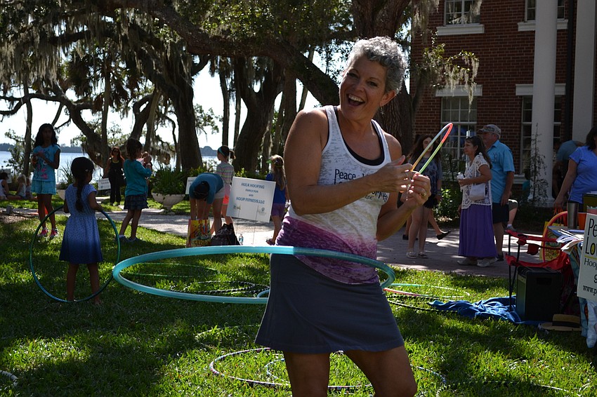 Amy Raspiller of Peace, Love and Hoopiness gives hula hoop demonstrations on the lawn at Bay Preserve.