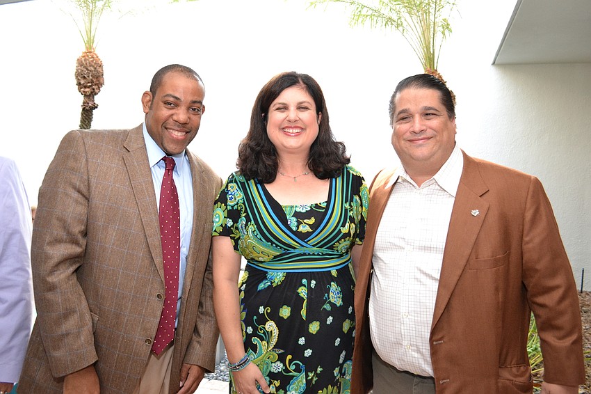 Riverview High School principal Paul Burns with Sarasota County Commissioner Christine Robinson and Eric Robinson