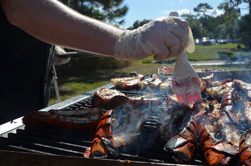 Shaun Frick, catering chef for Fete Ballroom, prepares lobster tail with tarragon butter.
