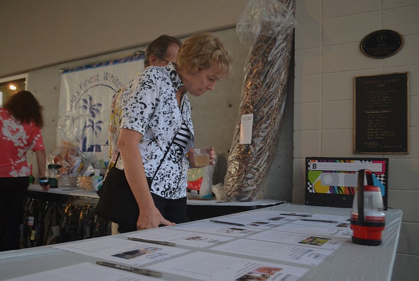 Marilyn Kneafsey looks at the prizes available for silent auction.