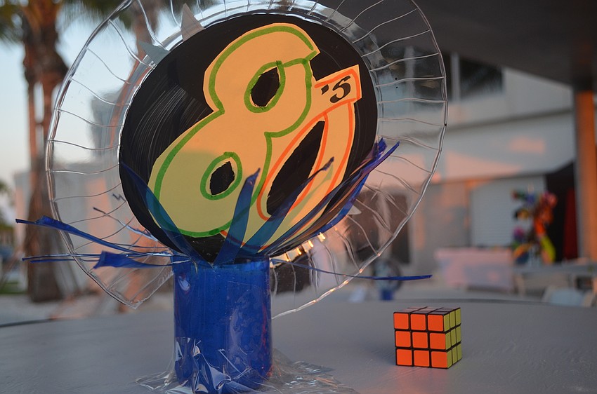 In addition to drinks, dancing and photo booths, attendees also fiddled with the Rubik's Cube that decorated the tables.