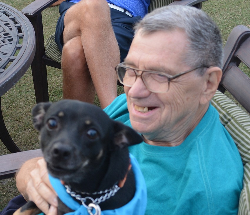 Shannon enjoys the lap of Marvin Fitzer.