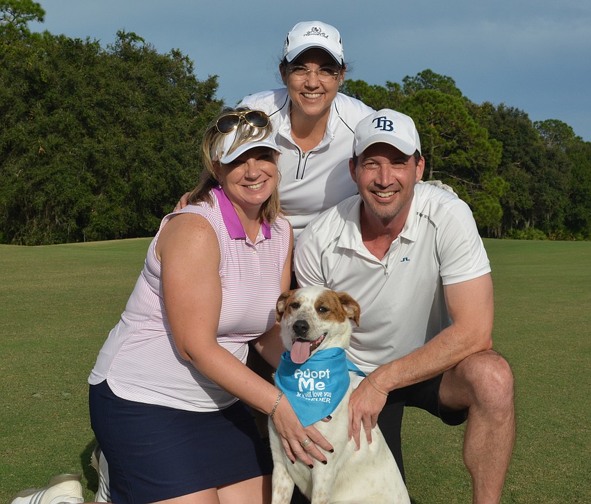 Jen Horvat, Lori Ruth and Craig Van Nortwick enjoy the company of Charlie.