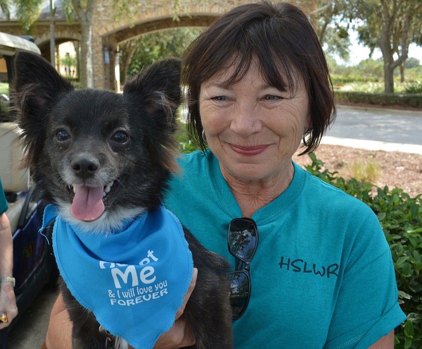 Denise Kepple sits with Shadow, who was adopted during the tournament.
