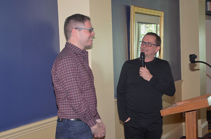 Christopher Hird, the new director of education for the Ballet, laughs as Director Iain Webb explains to the crowd that he recently learned Hird has a deep appreciation for ABBA.